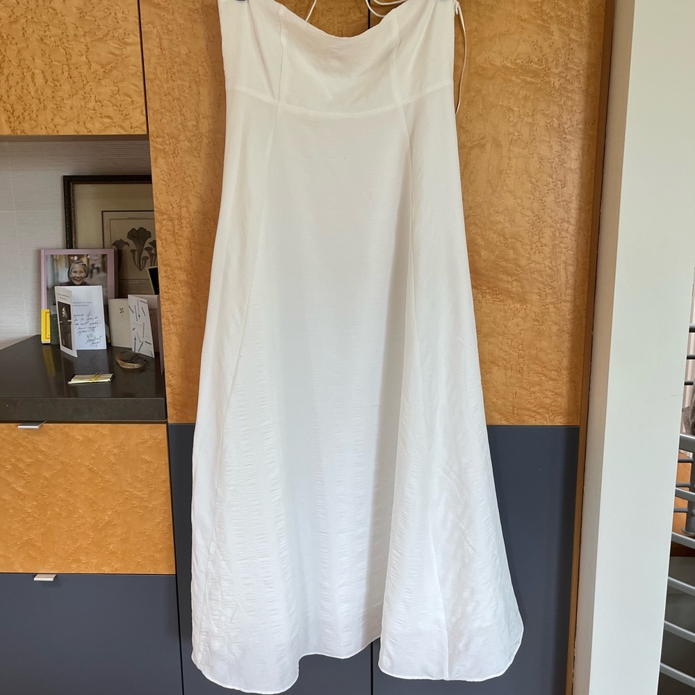Summer dress with spaghetti straps. Straps crisscross in the back. Side zipper.